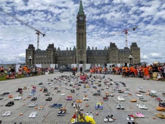 Thousands march in Canada to mourn residential school victims