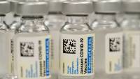 Americans abroad search for a first vaccine dose as millions at home get their third one