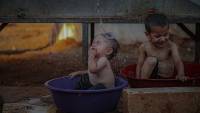 Civilians at Idlib camps in Syria feel heat as temperatures rise