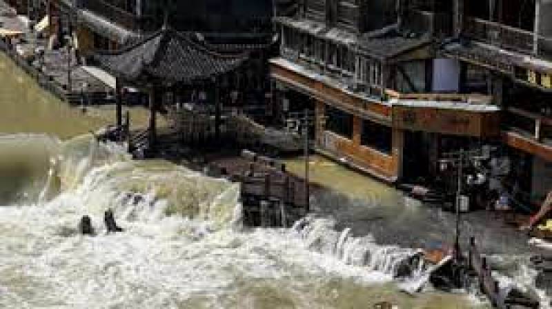 China floods kill a dozen people, thousands evacuated