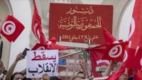 Thousands of Tunisians protest president’s move to expand powers