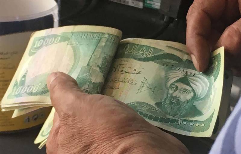 Iraq’s central bank devalues national currency