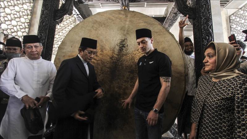 Mesut Ozil attends Friday prayers in Indonesia