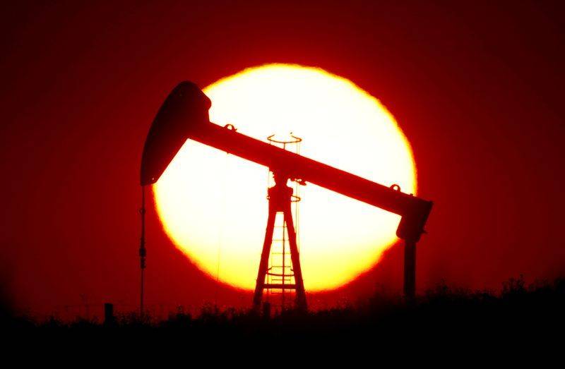 Oil gains as hurricane shuts U.S. output, stockpiles fall