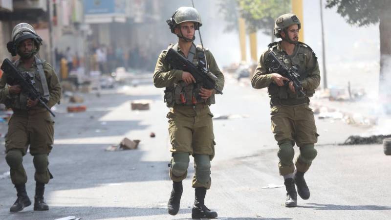 “Israeli” forces kill Palestinian youth, wound dozens in occupied West Bank