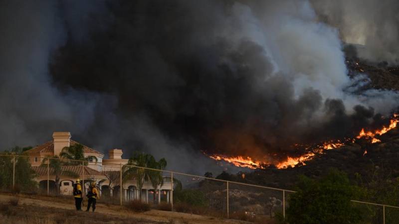 California firefighters struggle as wildfire doubles in size