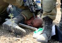 Image of Palestinian under Zionist soldier&#039;s knee sparks outrage